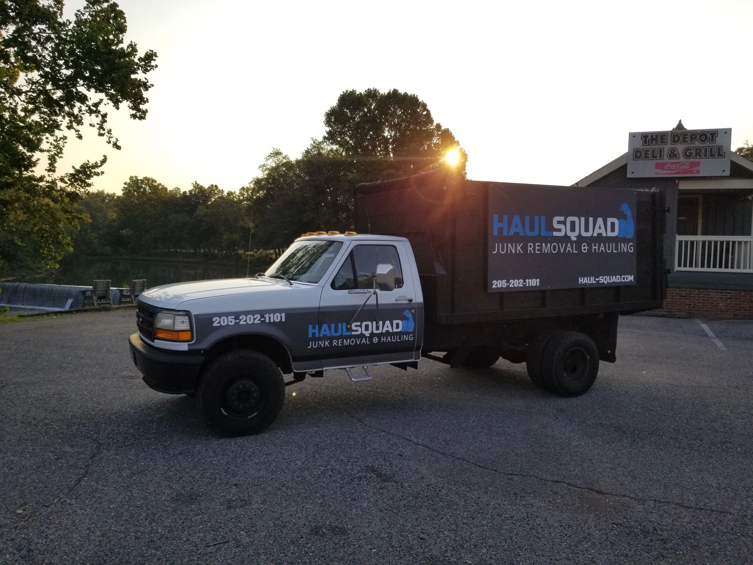 Haul Squad junk removal truck in Helena Alabama parked near the waterfall in Old Town Helena