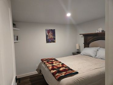 Cozy bedroom includes robes and closet to store your belongings.