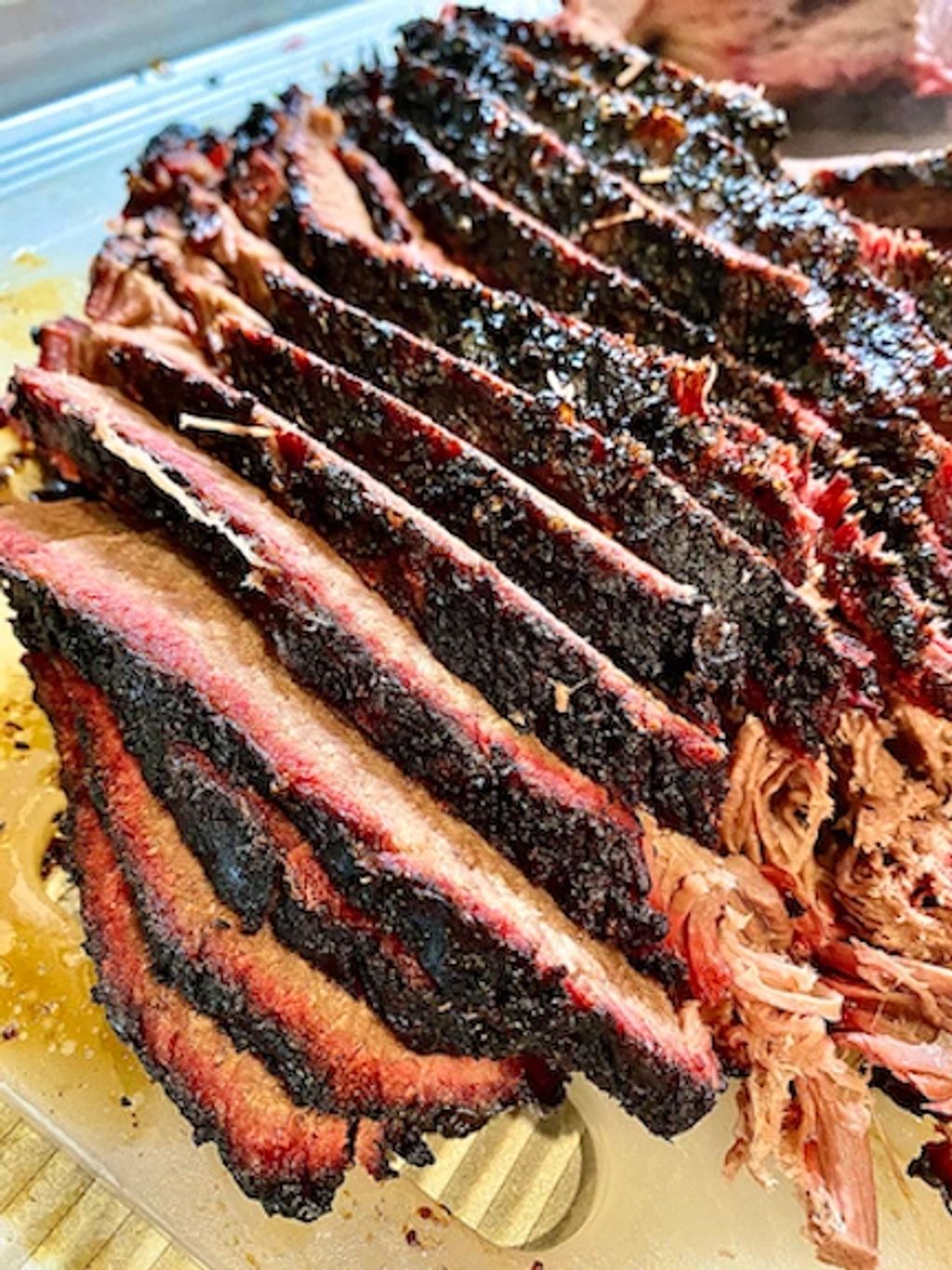 Hand-carved brisket with our signature dry rub