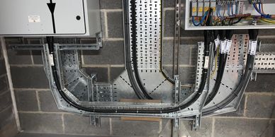 Industrial electrical distribution and switching using armoured cable and metal tray