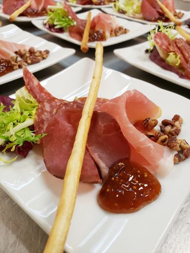 Locally-Cured Prosciutto, Bundnerfleisch, Pepperettes with Fig Jam catered by Sheraton Parkway Hotel