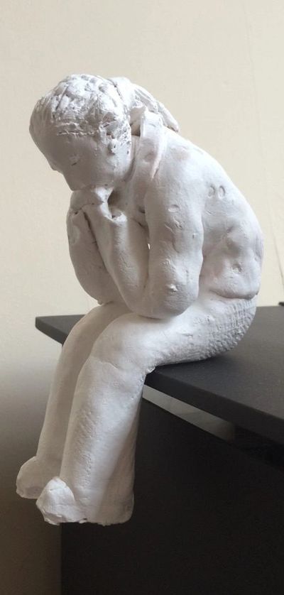 statue of a human thinking