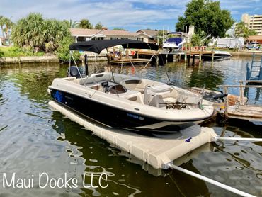 Bayliner Element 21 ft on Wave Armor Genesis 20 boat lift installed by Maui Docks in Tampa