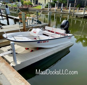 13 ft Boston Whaler on a Wave Armor Apex6 boat lift installed by Maui Docks in Orlando Florida.