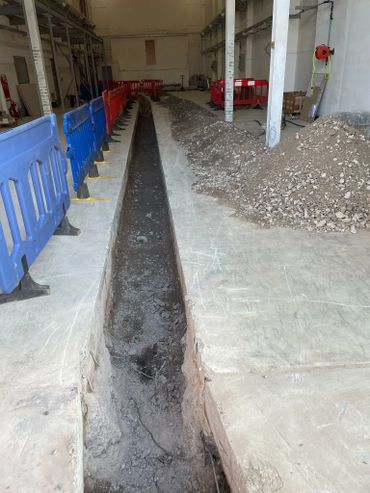 Concrete. breaking out of concrete. Digger and dumper. Civils.