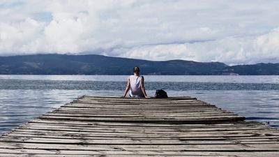 Grieving  Man on dock looking to water. Grief is different for everyone . Counseling can help.