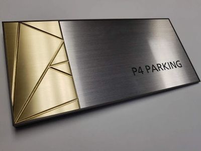 High rise parking sign with brushed aluminum and brushed bronze finishes
