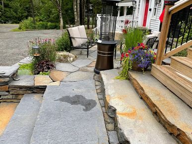 Side view: large stone steps installed at this inn, the small landing area on the steps gives access