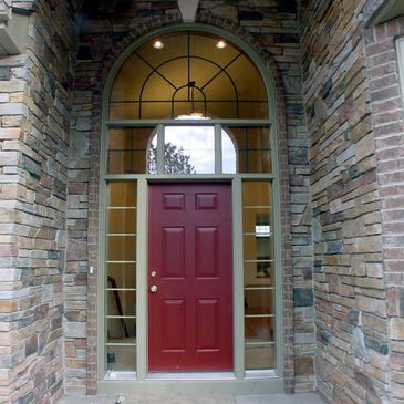 Custom home front door, windows, stone