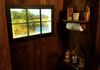 window sash turned into a "window overlooking a farm" by mounting LED lights behind frame illuminating a portrait of local farm