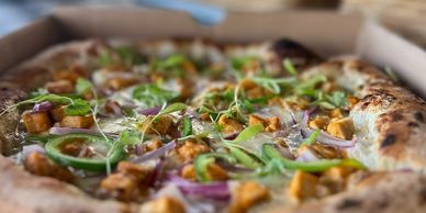 Vegetable pizza with green peppers and onions.