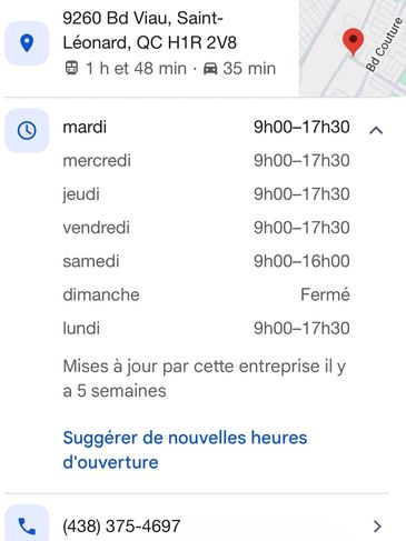 Photo showing business address and weekly opening hours in French.