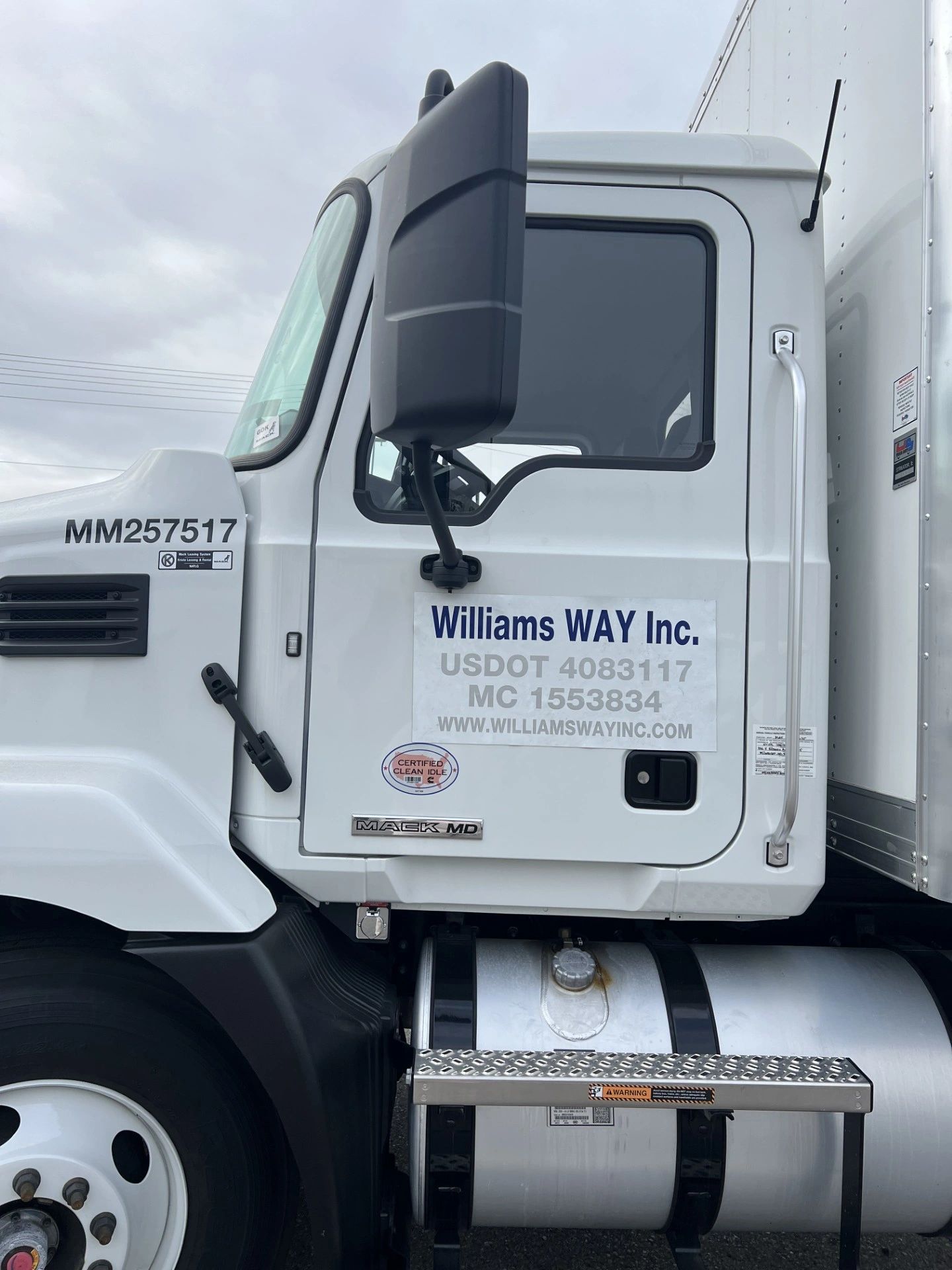 Side view of a Williams WAY Inc. Mack MD truck cab.