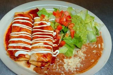 Enchiladas with beans and guacamole salad in cheektowaga new york..