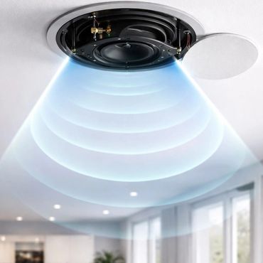 Ceiling speaker emitting sound waves in a modern living room.