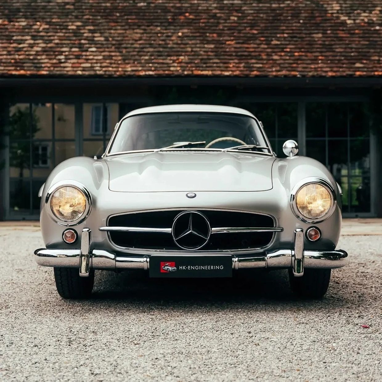 Front view of a classic silver Mercedes-Benz car.