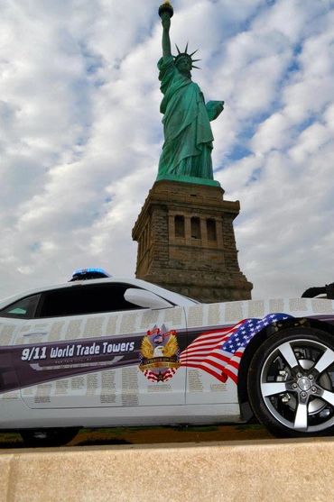 9/11 World Trade Tower Tribute Car at the base of the Statue of Liberty