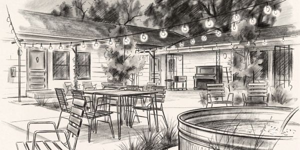 Outdoor patio with string lights and seating.