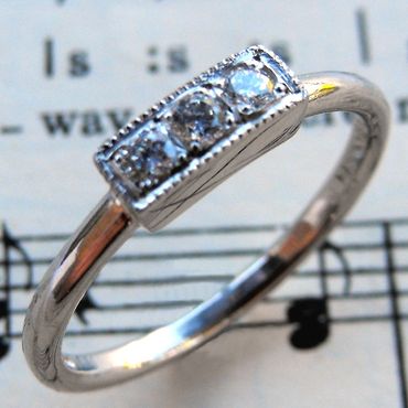 Engagement ring. Three lovely diamonds set in Palladium. Made for musical friends.