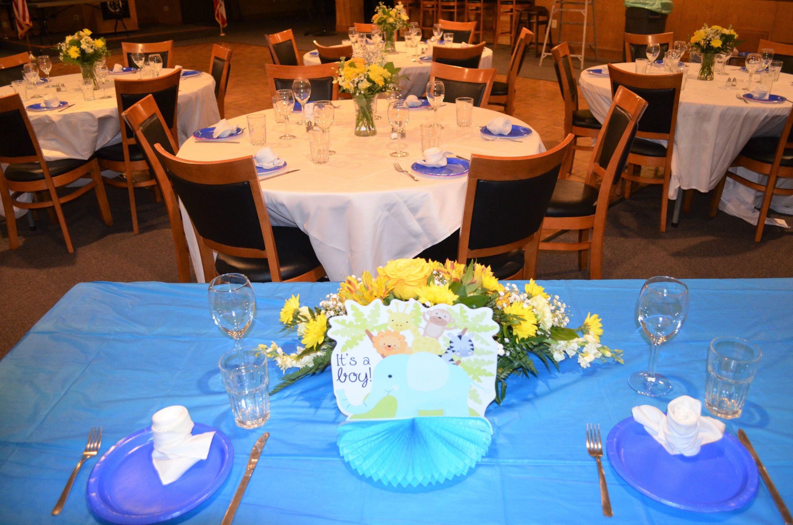 A photo taken in the Lodge Room showing table decorations for a baby shower.