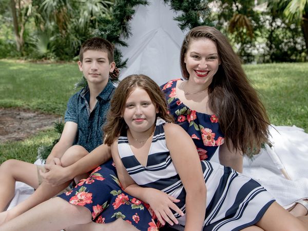 Intellidoc founder & CEO Dr. Jacqueline Darna with 2 children stating most important job being a mom