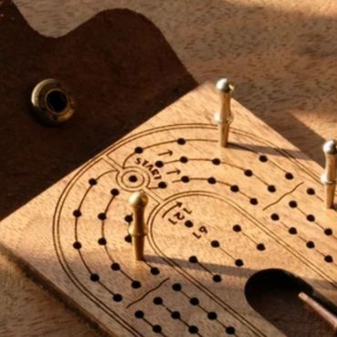 Travel Cribbage Board on Partial Closeup in Shadow | KNODY