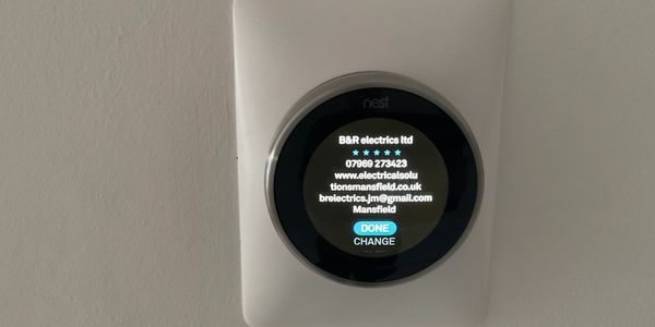Smart home controls showing a Nest thermostat. 