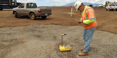 Testing for optimal compaction and moisture content with a nuclear gauge.  