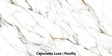 CALACATTA LUXE porcelain features a off white background and sapphire, brass veins