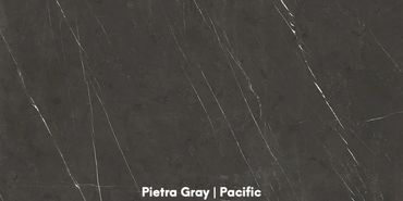 PIETRA GREY Porcelain has a color and pattern that features a deep charcoal-gray or dark brown backg