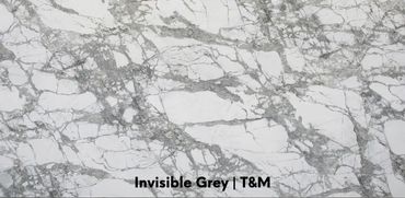 Invisible Grey porcelain is characterized by an off-white or ivory background with refined grey, tau