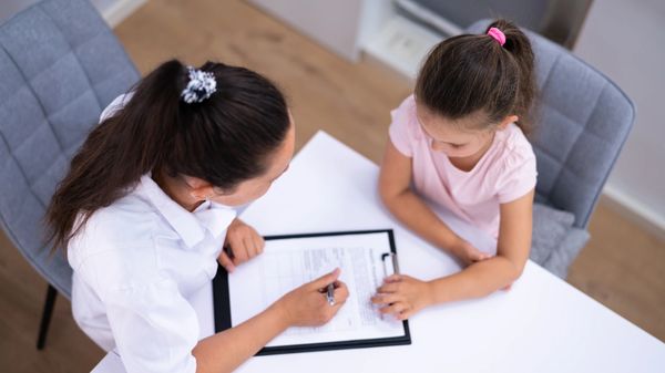 woman fill in the form with a girl