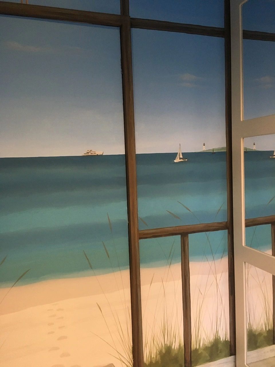 Sandy beach mural in a bathroom.