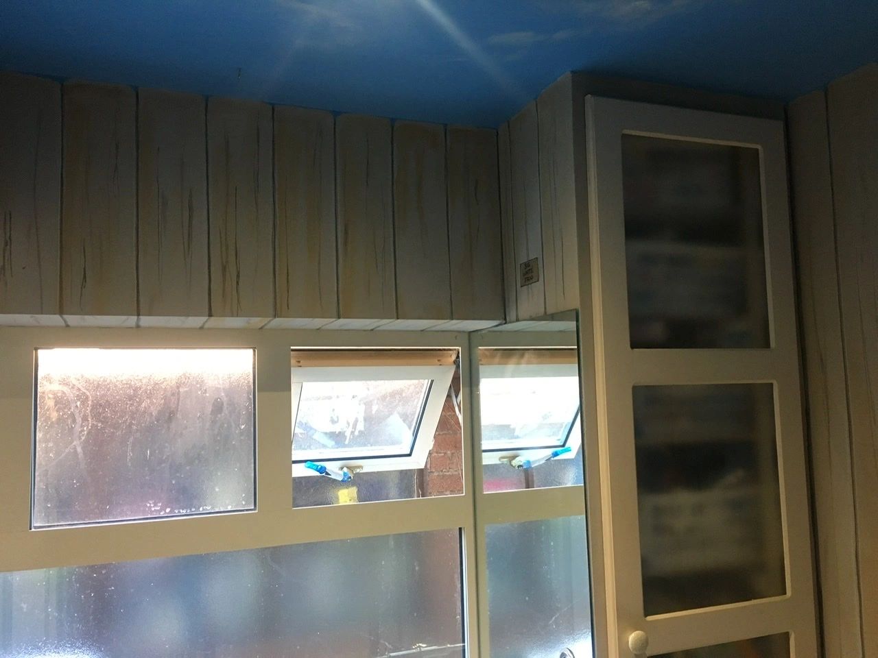 A bathroom painted to look like wood panelling.