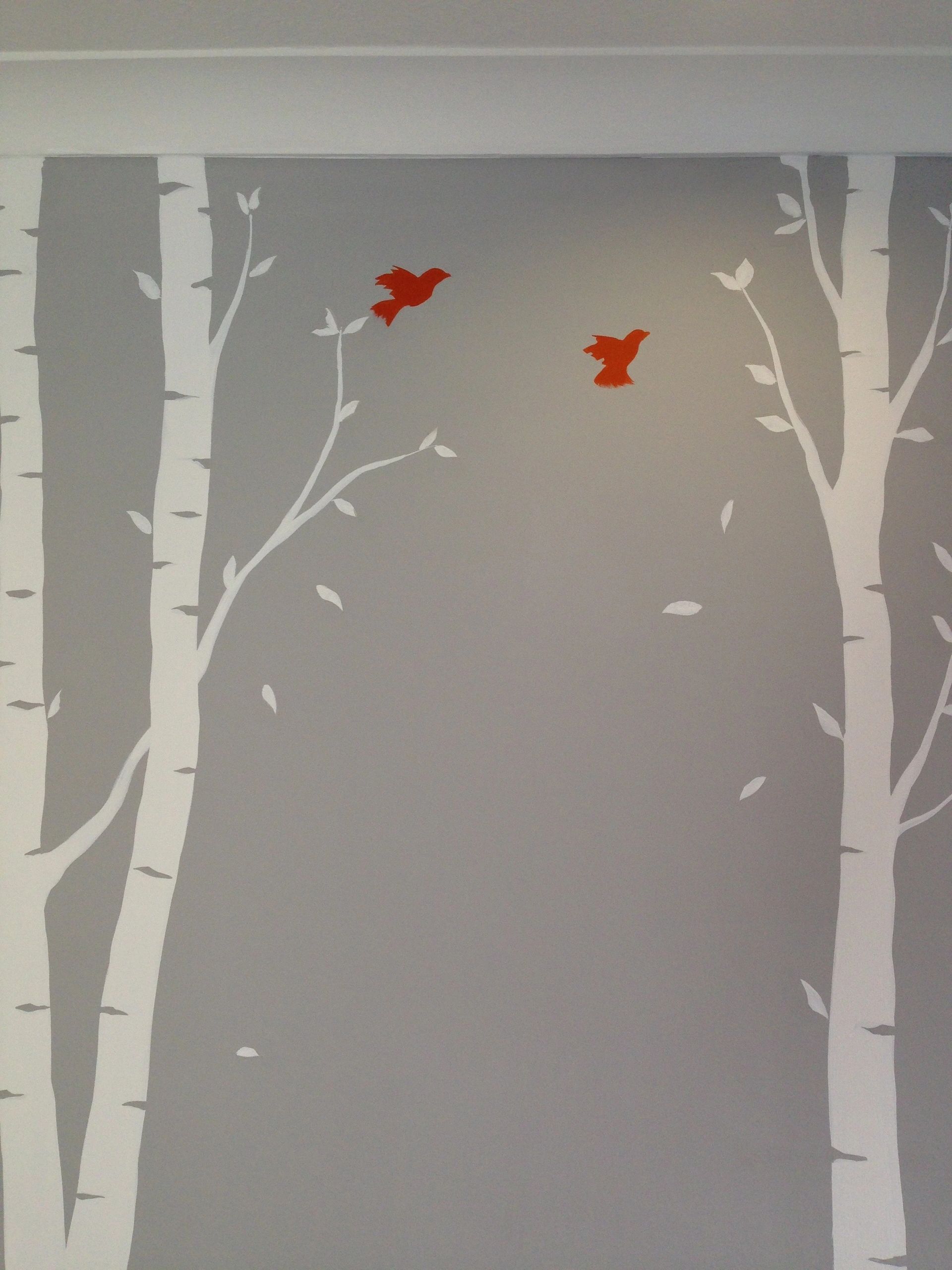 Birch tree mural painted in a nursery room.