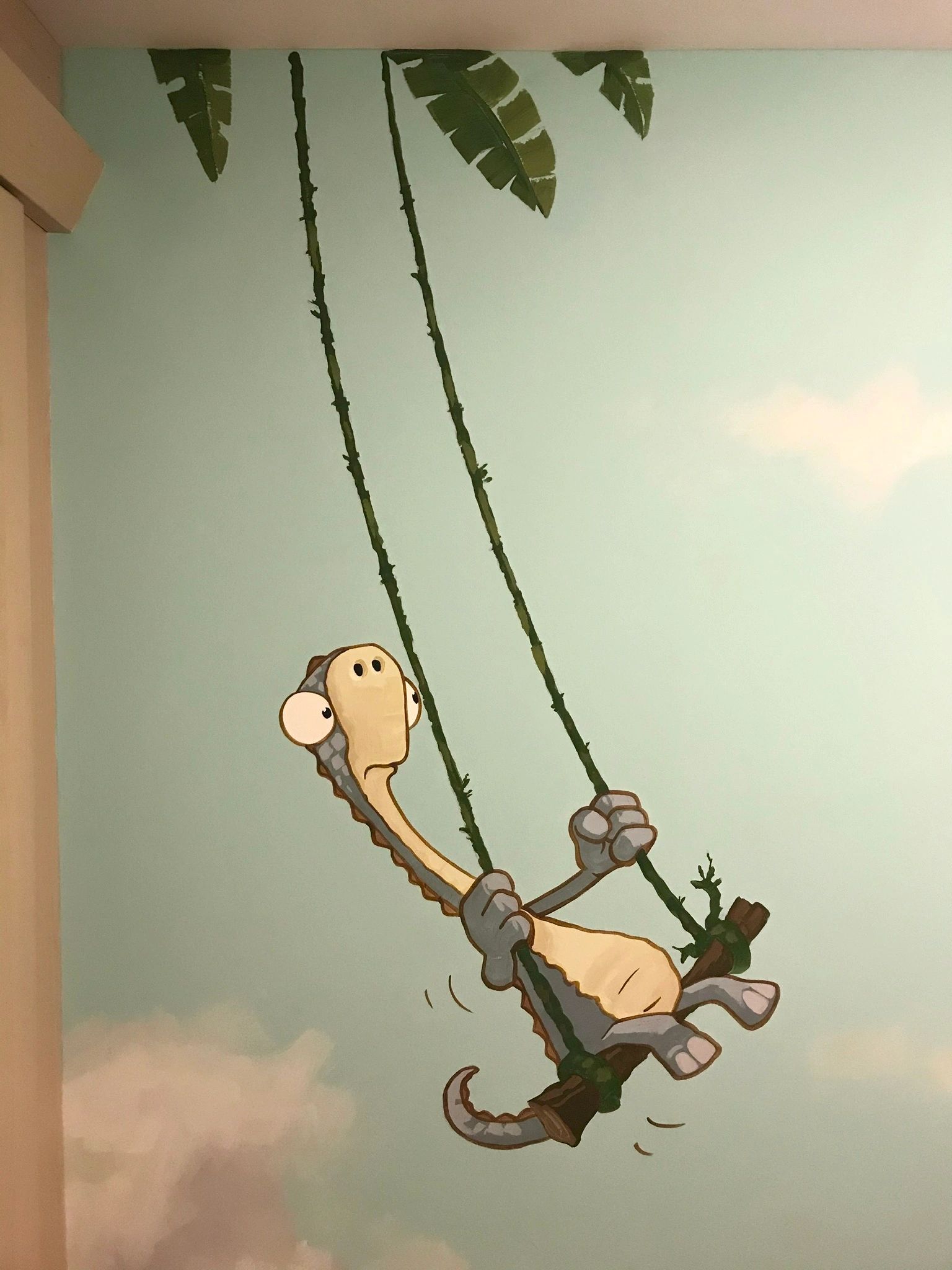 Tiny, the Gigantasaurus dinosaur painted in a nursery room