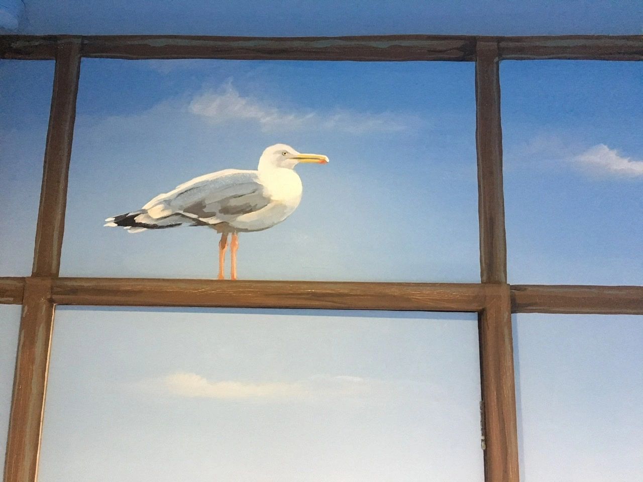 Seagull mural in a bathroom.