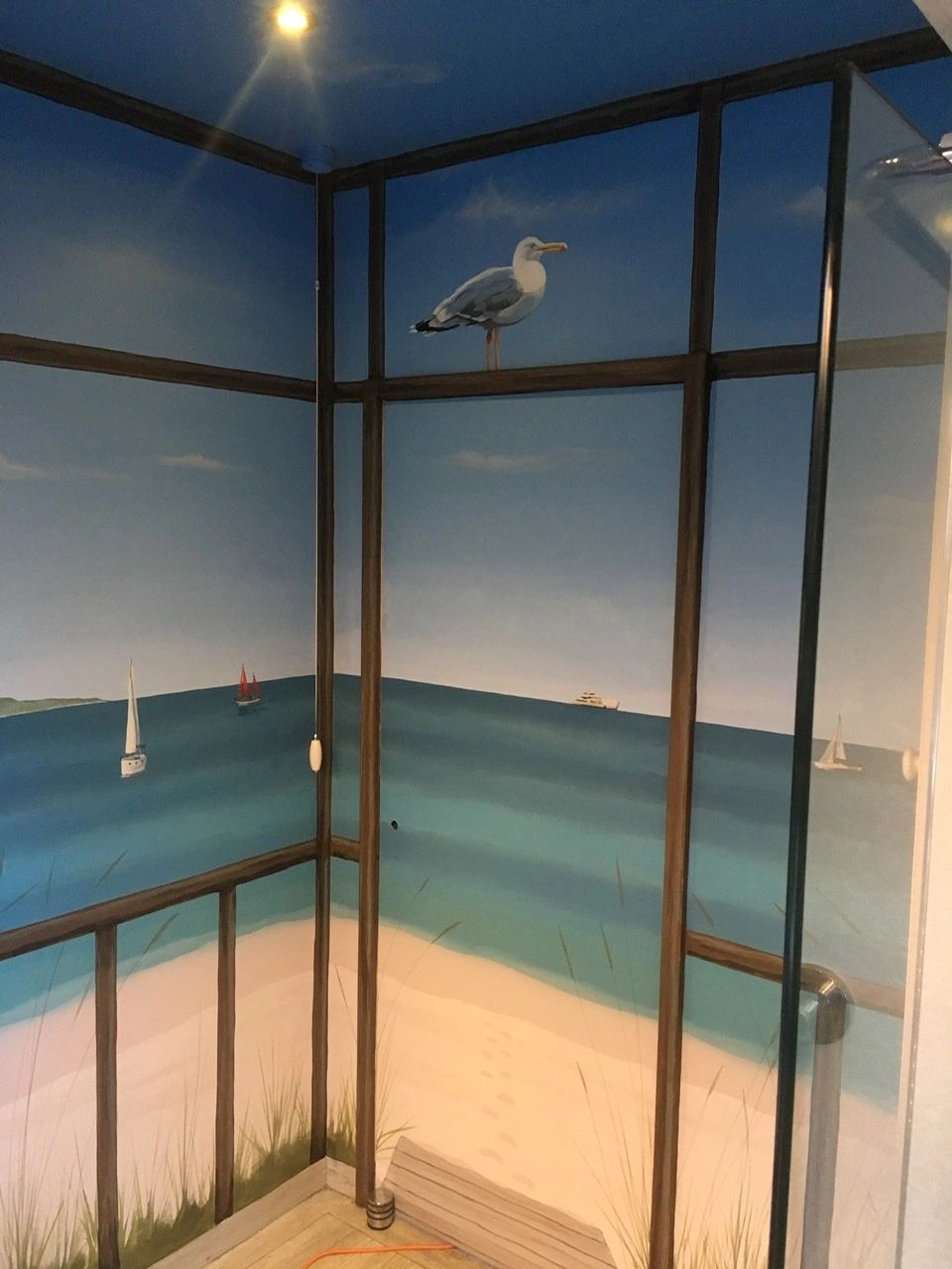 Beach mural in a bathroom