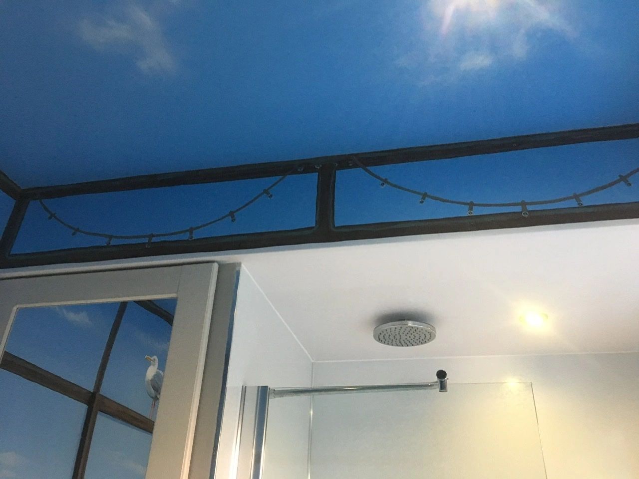 Sky ceiling in a bathroom.
