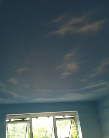 Sky ceiling mural painted in a bedroom