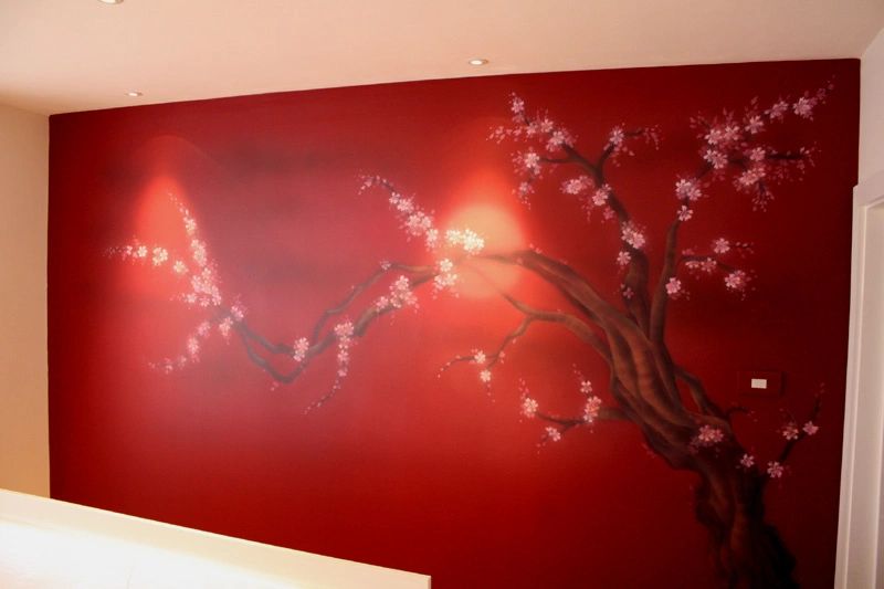 Painted blossom art on a bedroom wall