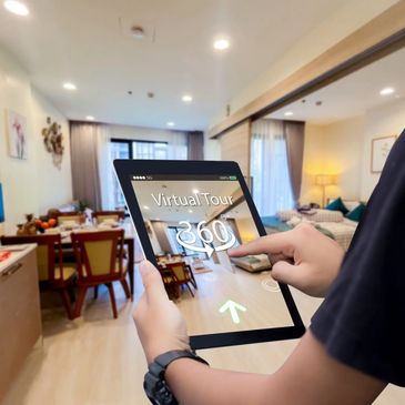 Person using a tablet for a 360-degree virtual tour of a modern apartment.