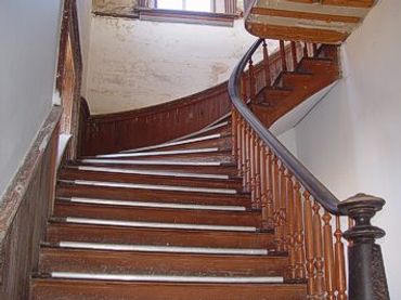 One of two curved stairs leading to the courtroom
