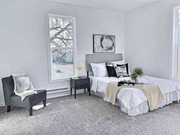 Light and bright modern bedroom staging. 