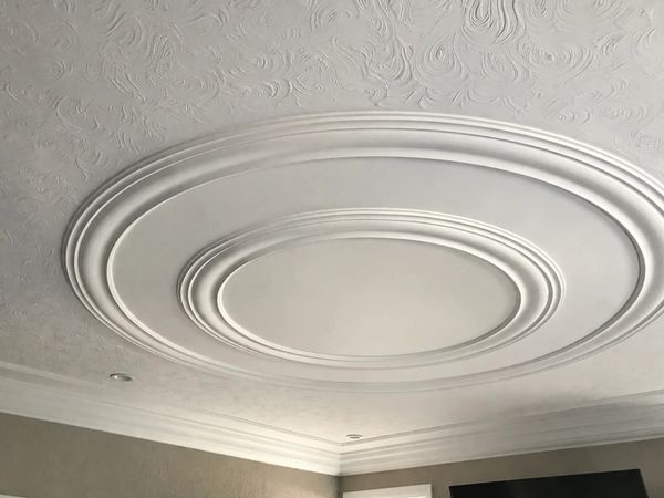 Decorative circular ceiling design with multiple rings.