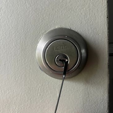 Close-up of a lock with a key inserted.