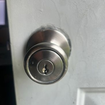 Close-up of a silver door knob with a keyhole.