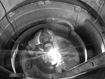Millwright inside crusher completing repairs