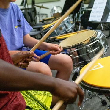 Students having fun practicing together at Drum Camp.