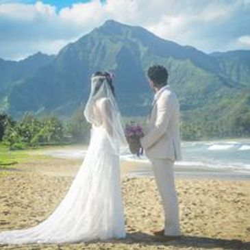 Kauai Beach Wedding Hanalei Bay secluded beach Hawaii wedding photography bride and groom with mountain backdrop 